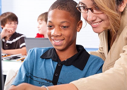 Teacher working with a teenage student